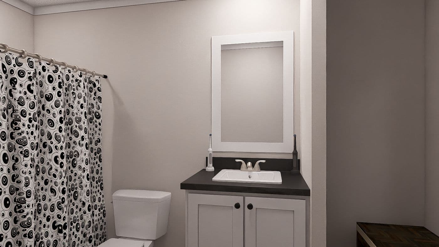 The WHOLE LOTTA LOVE Guest Bathroom. This Manufactured Mobile Home features 3 bedrooms and 2 baths.