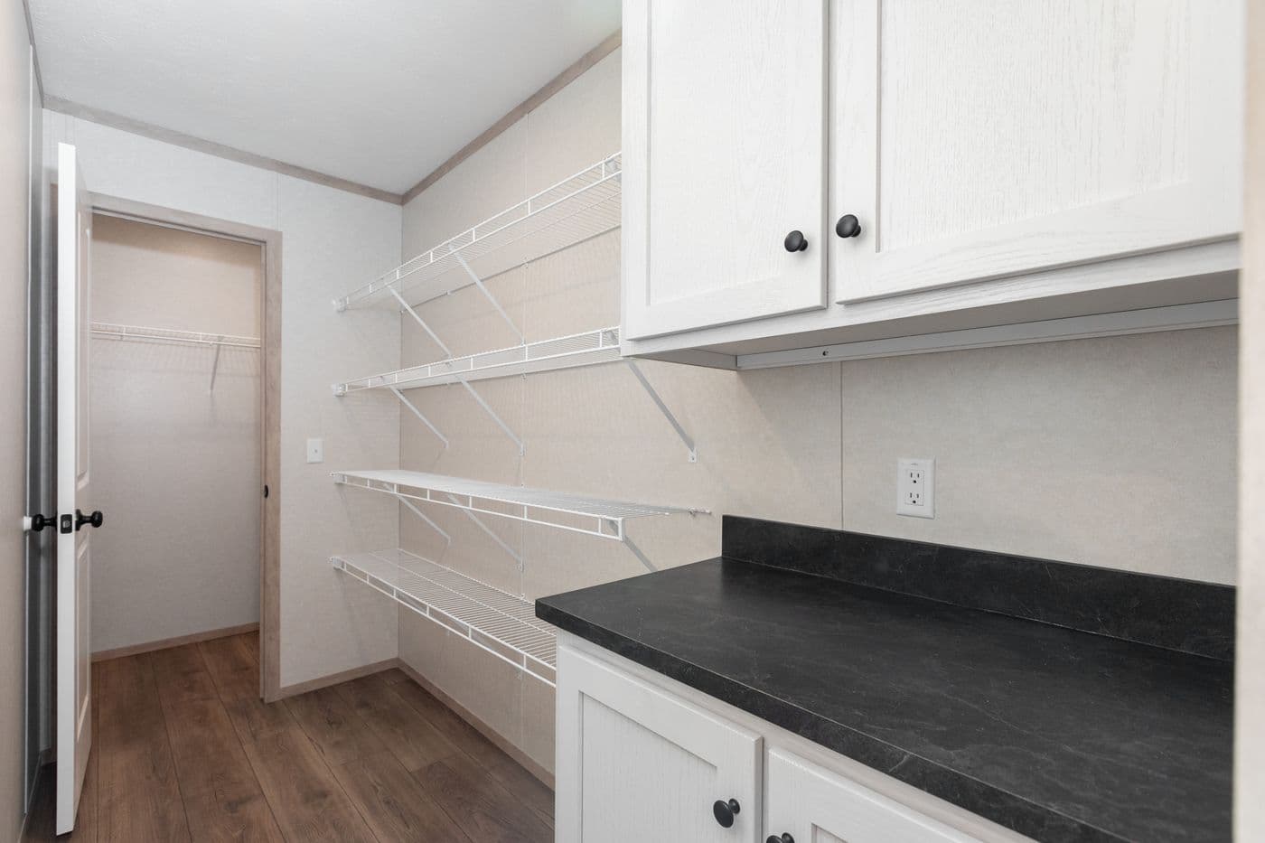 The 6032-5700 THE PULSE Storage. This Manufactured Mobile Home features 3 bedrooms and 2 baths.