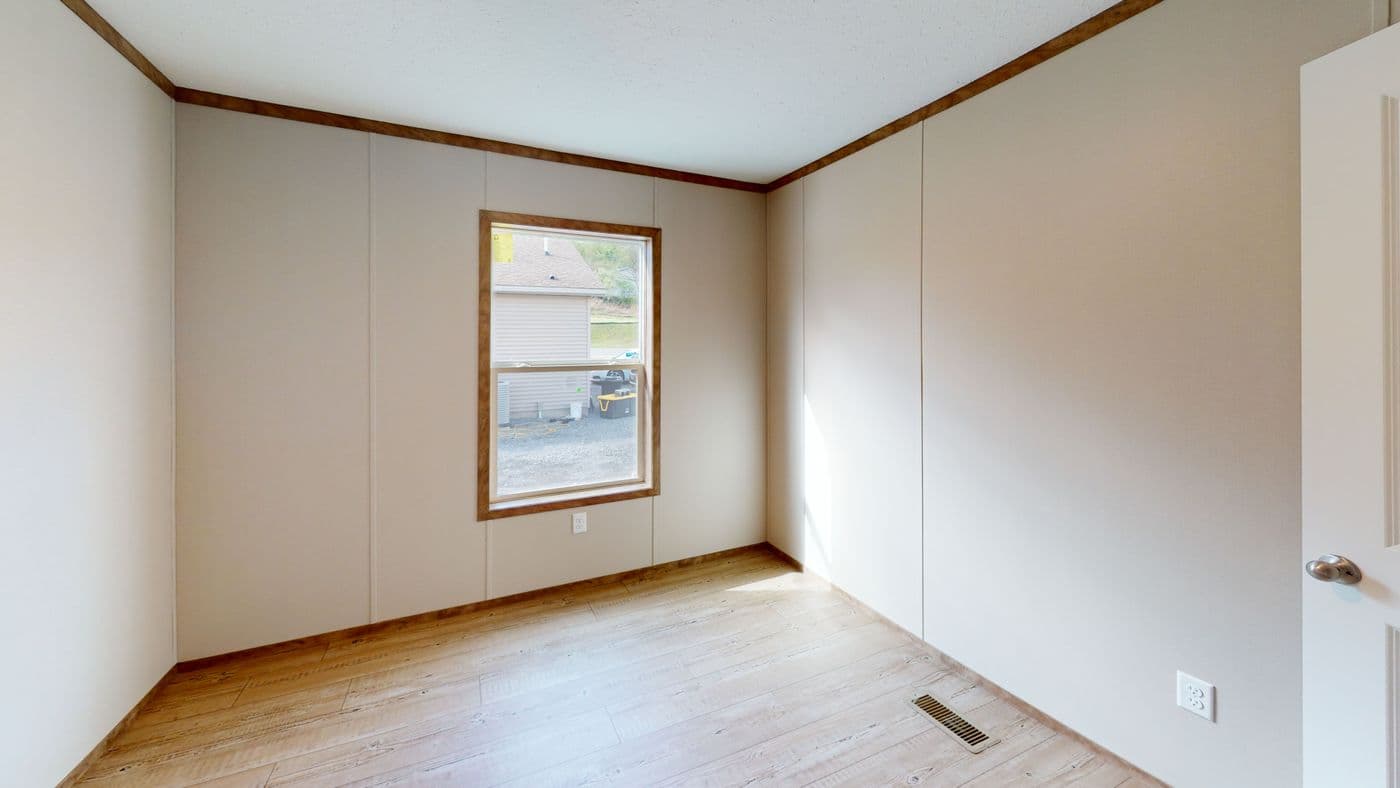 The BOONE Guest Bedroom. This Manufactured Mobile Home features 4 bedrooms and 2 baths.