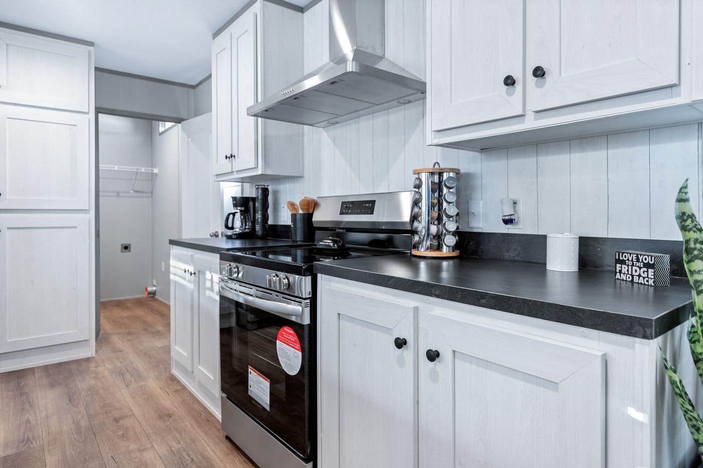 The RESOLUTION 16763X Kitchen. This Manufactured Mobile Home features 3 bedrooms and 2 baths.