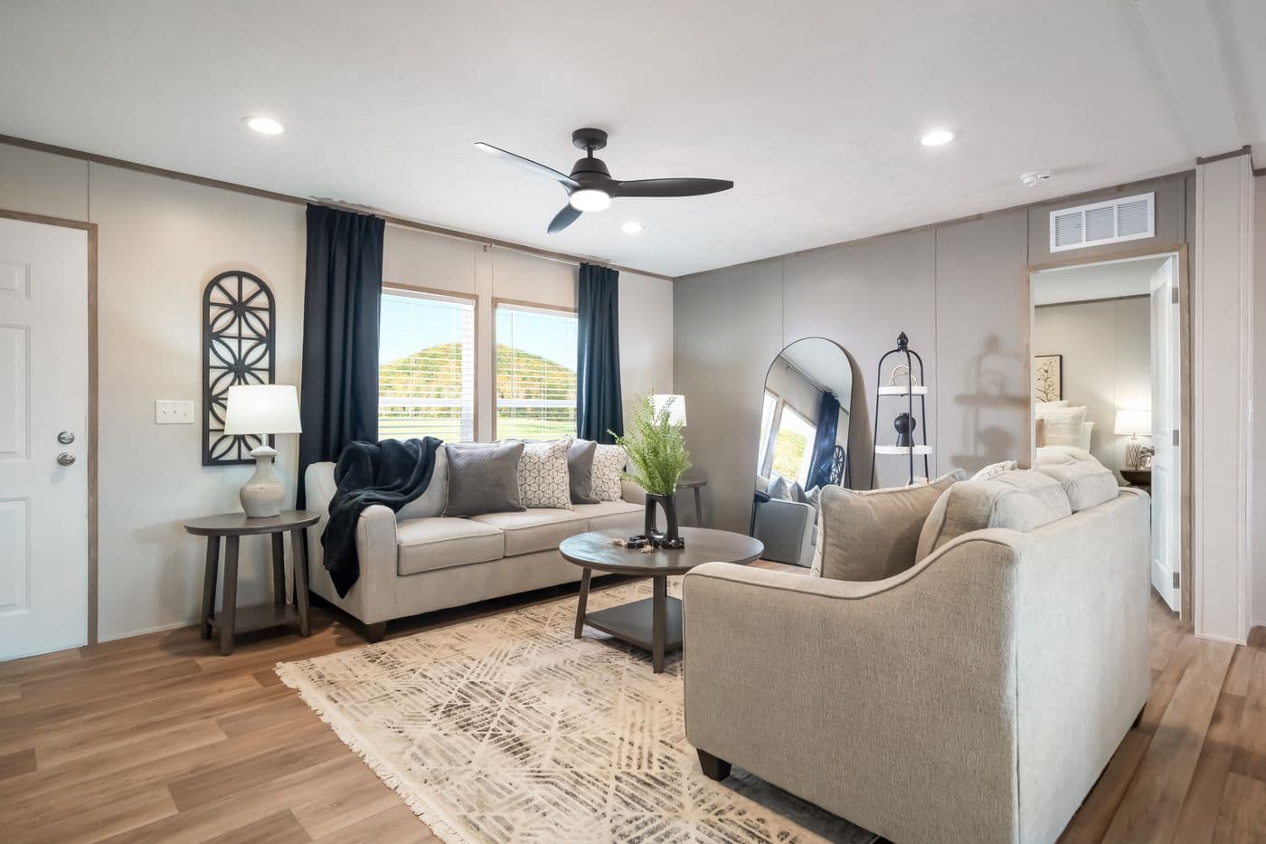 The ECLIPSE Living Room. This Manufactured Mobile Home features 4 bedrooms and 2 baths.