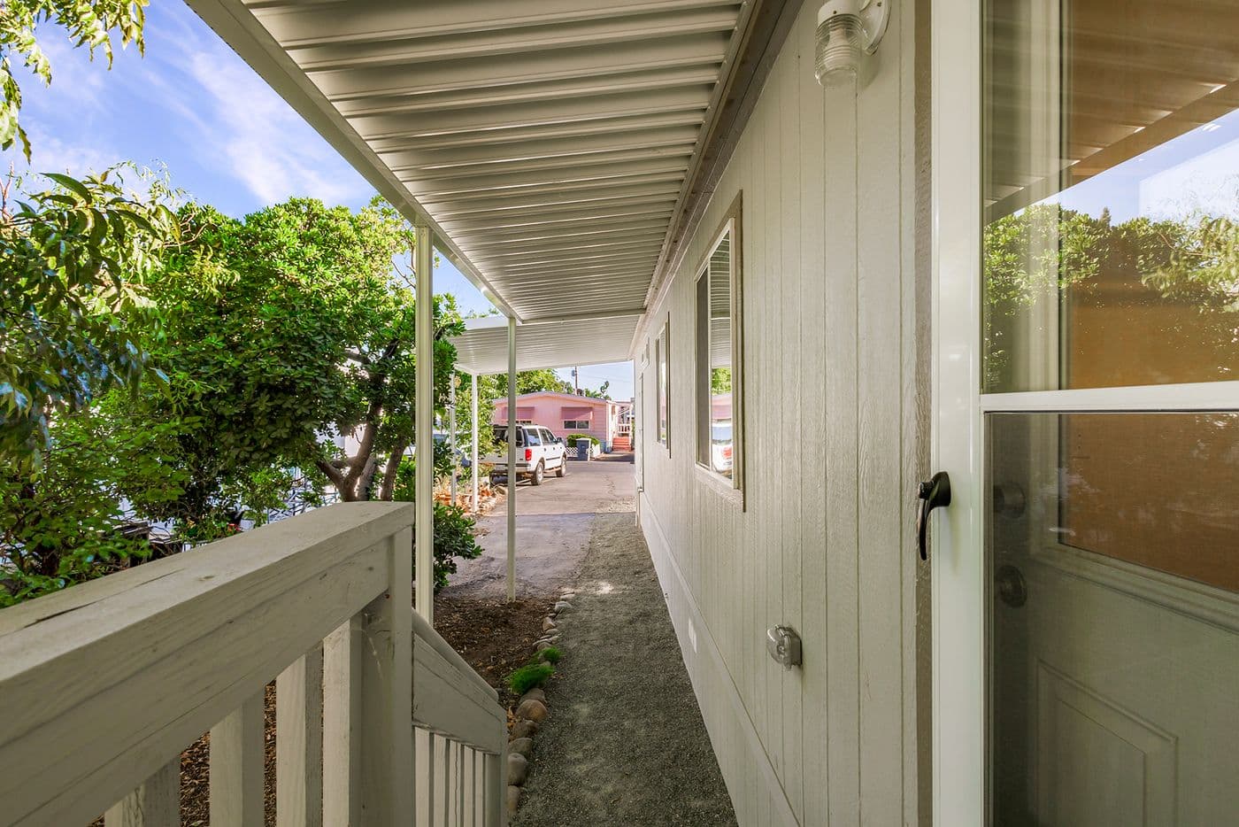Utility room steps view of carport