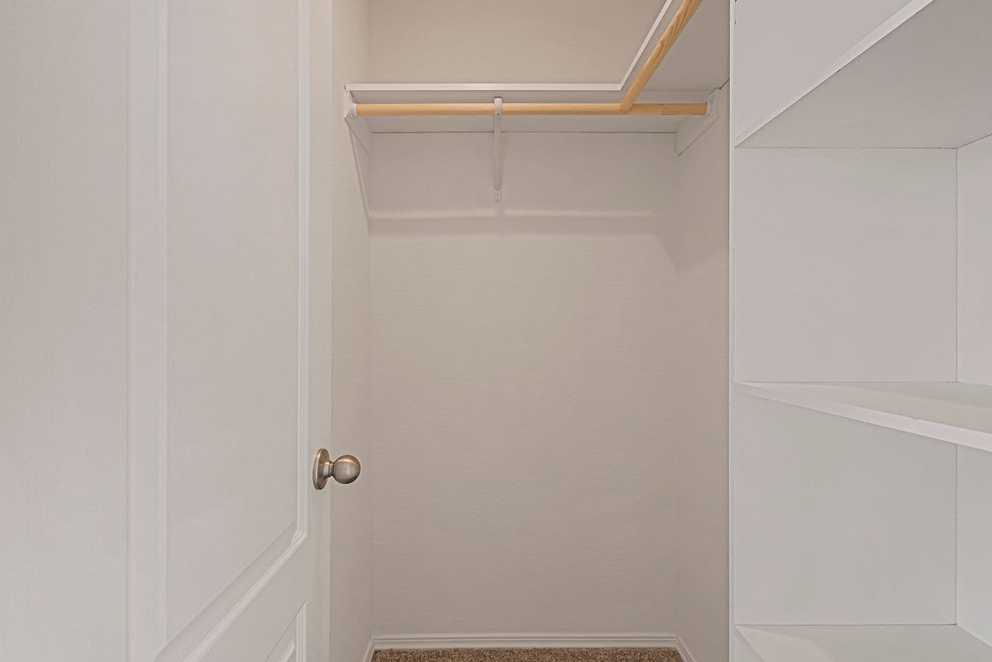 Primary bedroom walk-in closet