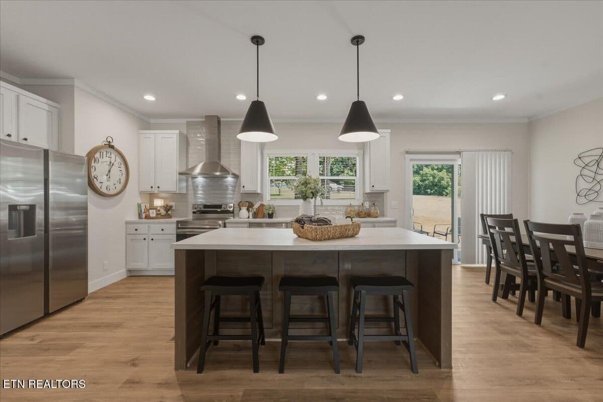 The large island is perfect for baking or cooking your favorite dish.  With room to seat or seve 3, it may become the center of your household.