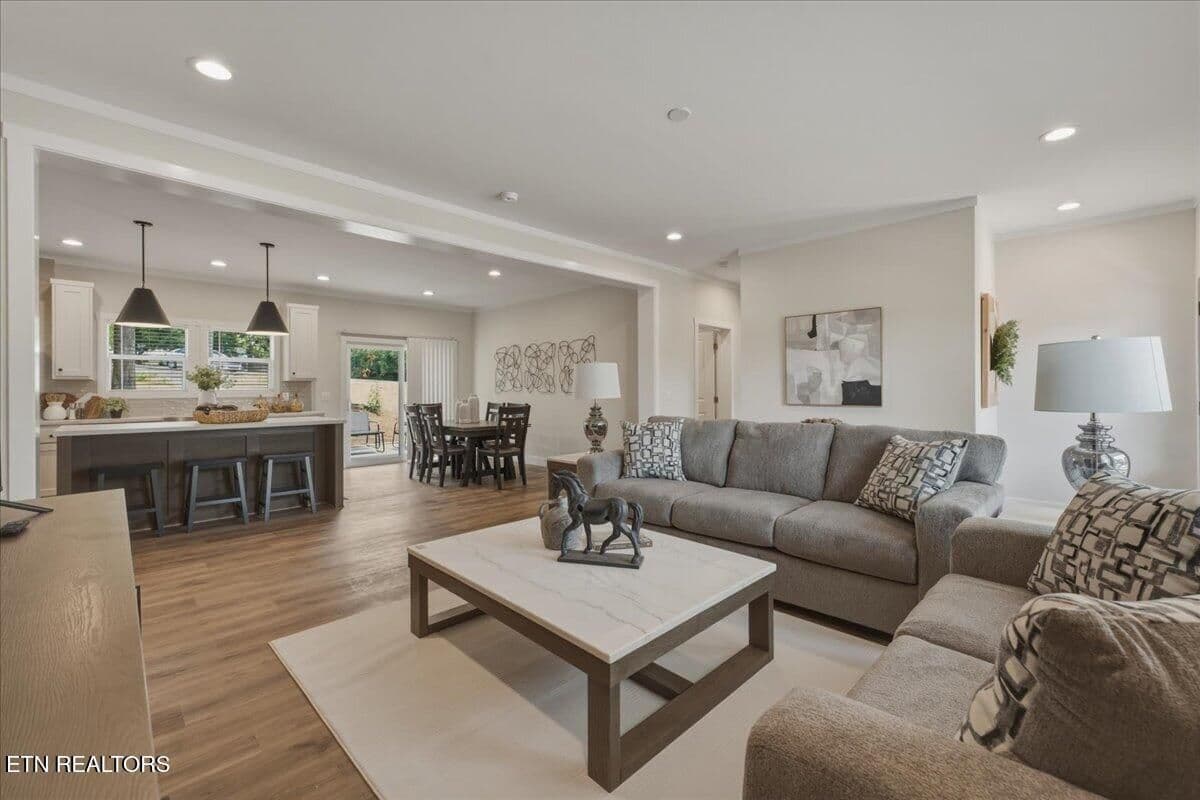 Friends and family con interact from the Living Room, Kitchen and Dining room.