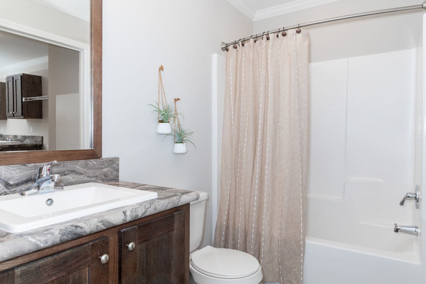 The THE VILLETTE Guest Bathroom. This Manufactured Mobile Home features 3 bedrooms and 2 baths.