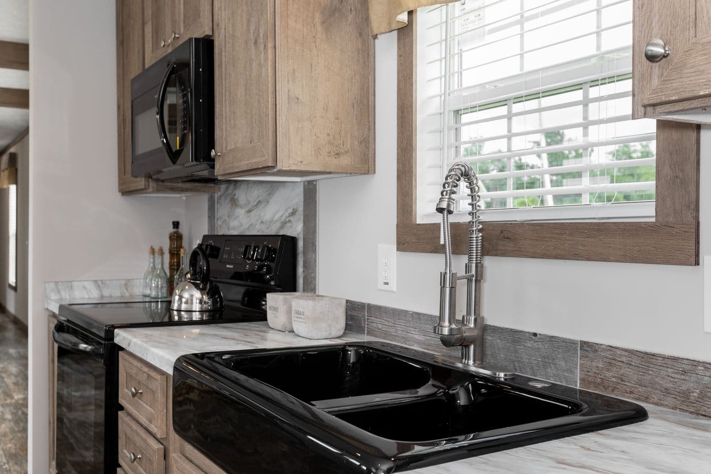 The THE WALSH Kitchen. This Manufactured Mobile Home features 3 bedrooms and 2 baths.