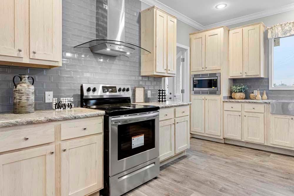 The THE TILLEY Kitchen. This Manufactured Mobile Home features 3 bedrooms and 2 baths.