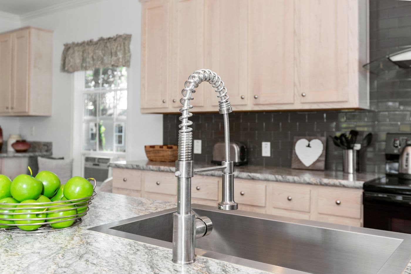The NORMANDY Kitchen. This Manufactured Mobile Home features 3 bedrooms and 2 baths.