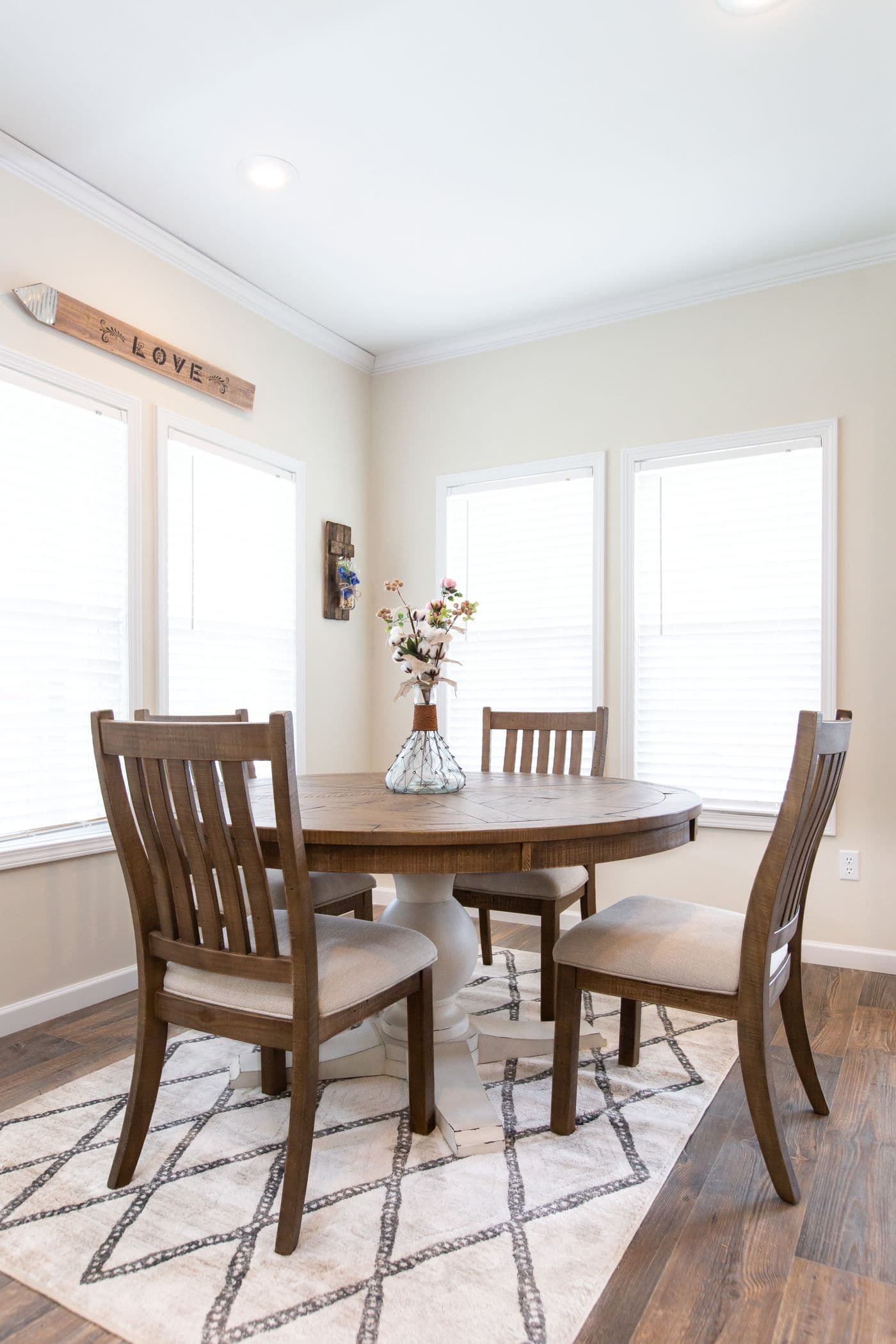 The SOUTHERN CHARM 4 BR Dining Room. This Manufactured Mobile Home features 4 bedrooms and 2 baths.