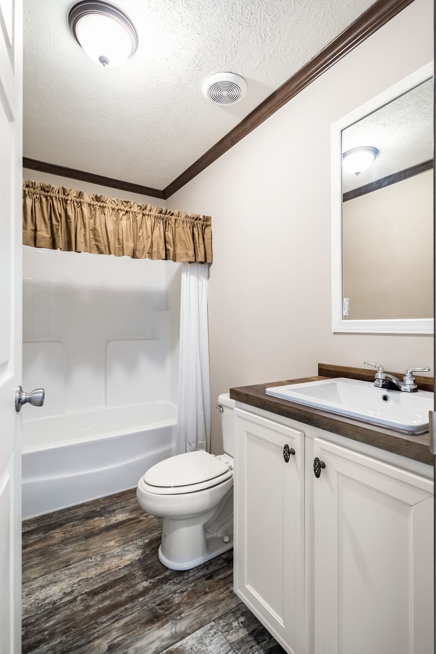 The THE STARK Guest Bathroom. This Manufactured Mobile Home features 3 bedrooms and 2 baths.