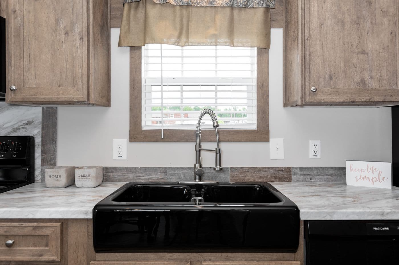 The THE WALSH Kitchen. This Manufactured Mobile Home features 3 bedrooms and 2 baths.