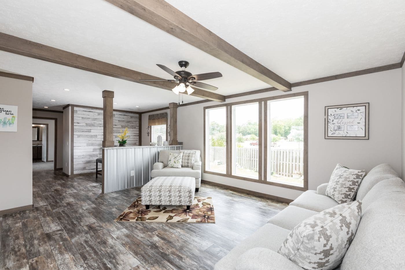 The THE WALSH Living Room. This Manufactured Mobile Home features 3 bedrooms and 2 baths.