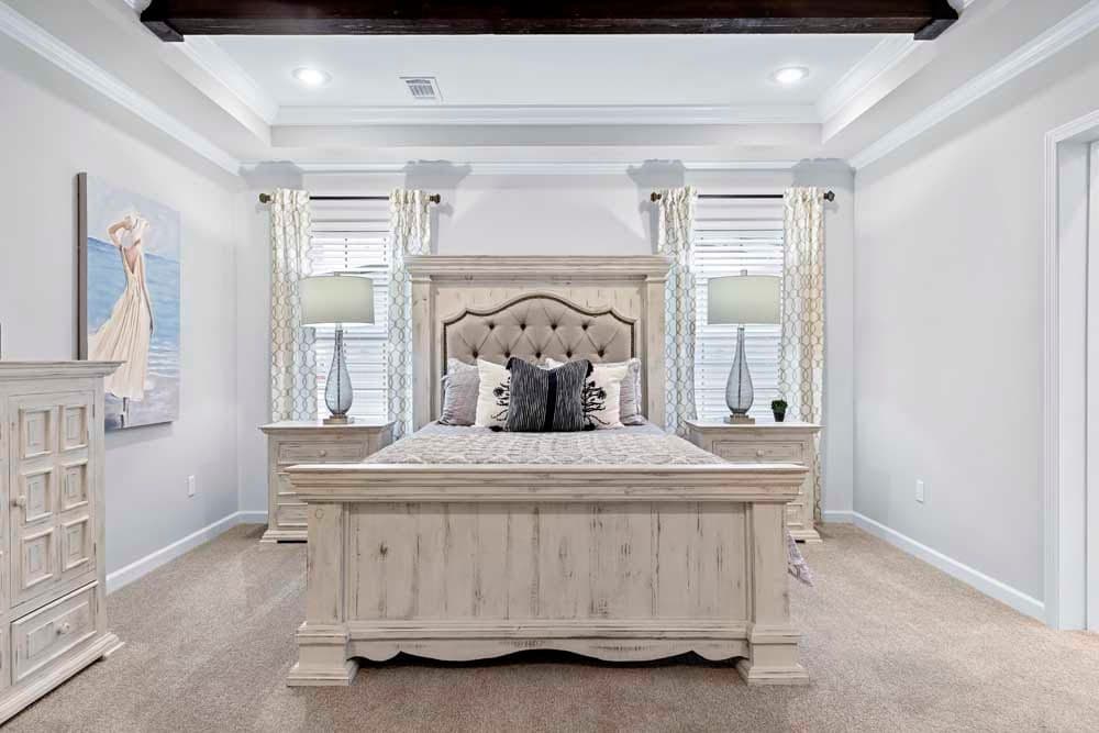 The THE TILLEY Primary Bedroom. This Manufactured Mobile Home features 3 bedrooms and 2 baths.