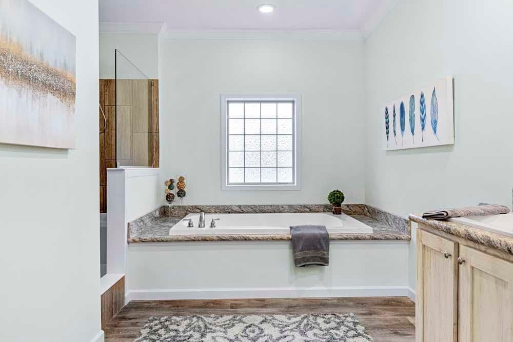 The THE TILLEY Primary Bathroom. This Manufactured Mobile Home features 3 bedrooms and 2 baths.