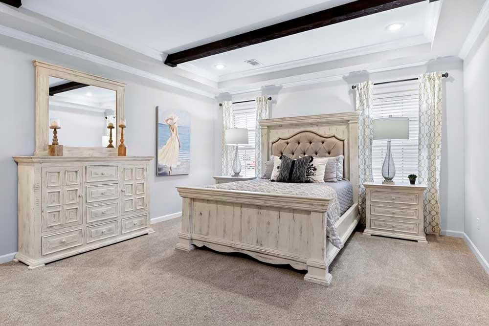 The THE TILLEY Primary Bedroom. This Manufactured Mobile Home features 3 bedrooms and 2 baths.