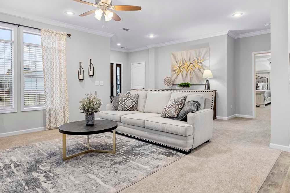 The THE TILLEY Living Room. This Manufactured Mobile Home features 3 bedrooms and 2 baths.