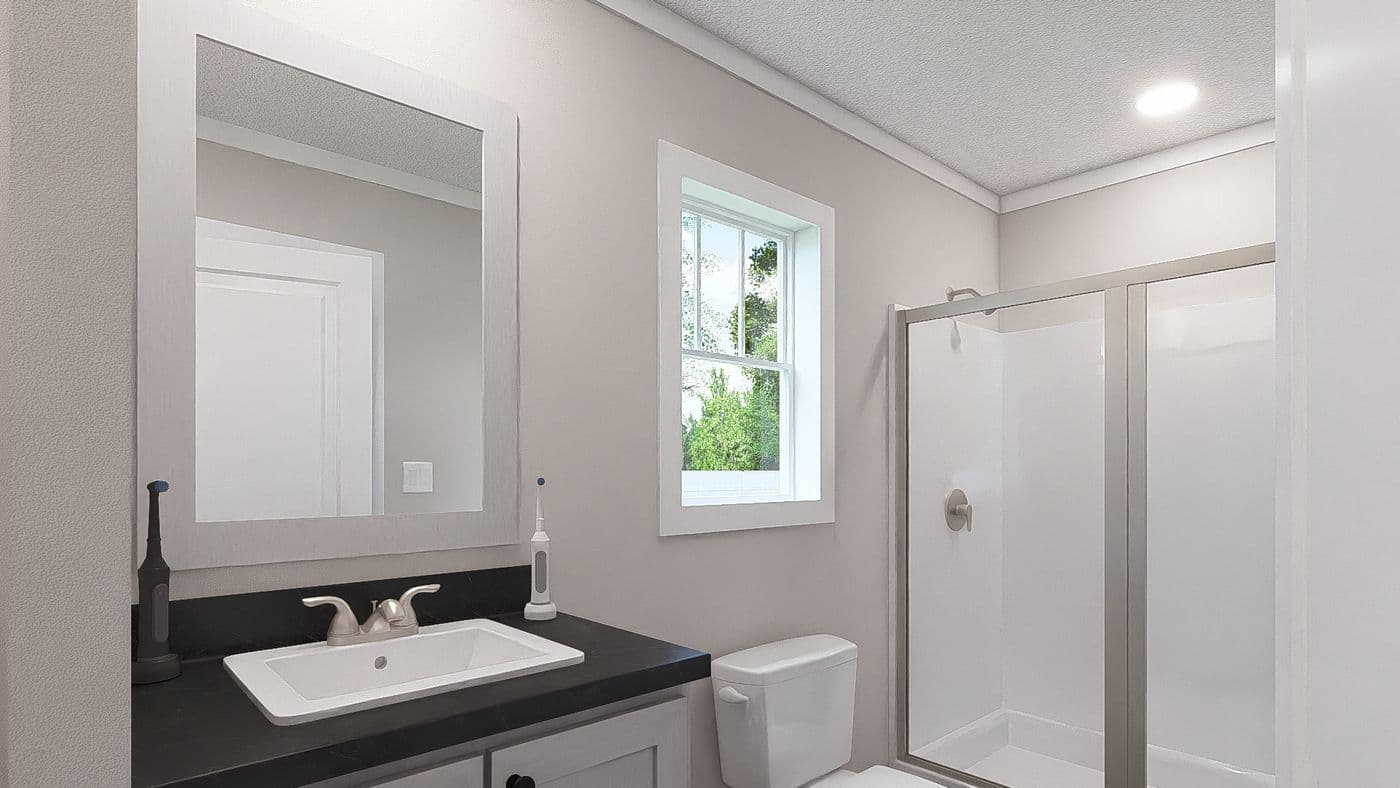 The STILL THE ONE Exterior. This Manufactured Mobile Home features 2 bedrooms and 2 baths.