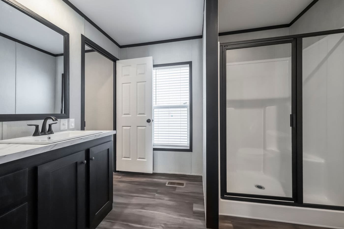 The LIL SOUTHERN CHARM Primary Bathroom. This Manufactured Mobile Home features 3 bedrooms and 2 baths.