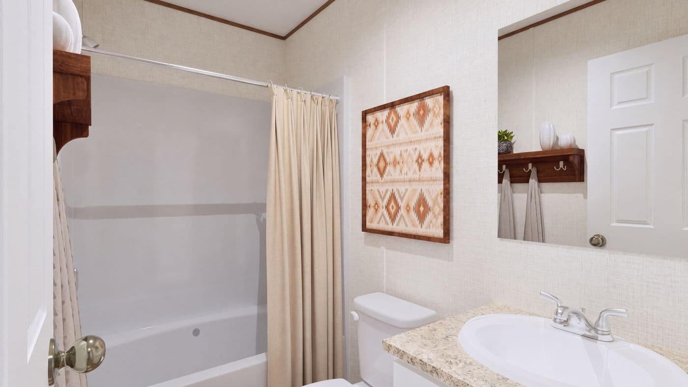 The CEDAR Guest Bathroom. This Manufactured Mobile Home features 3 bedrooms and 2 baths.