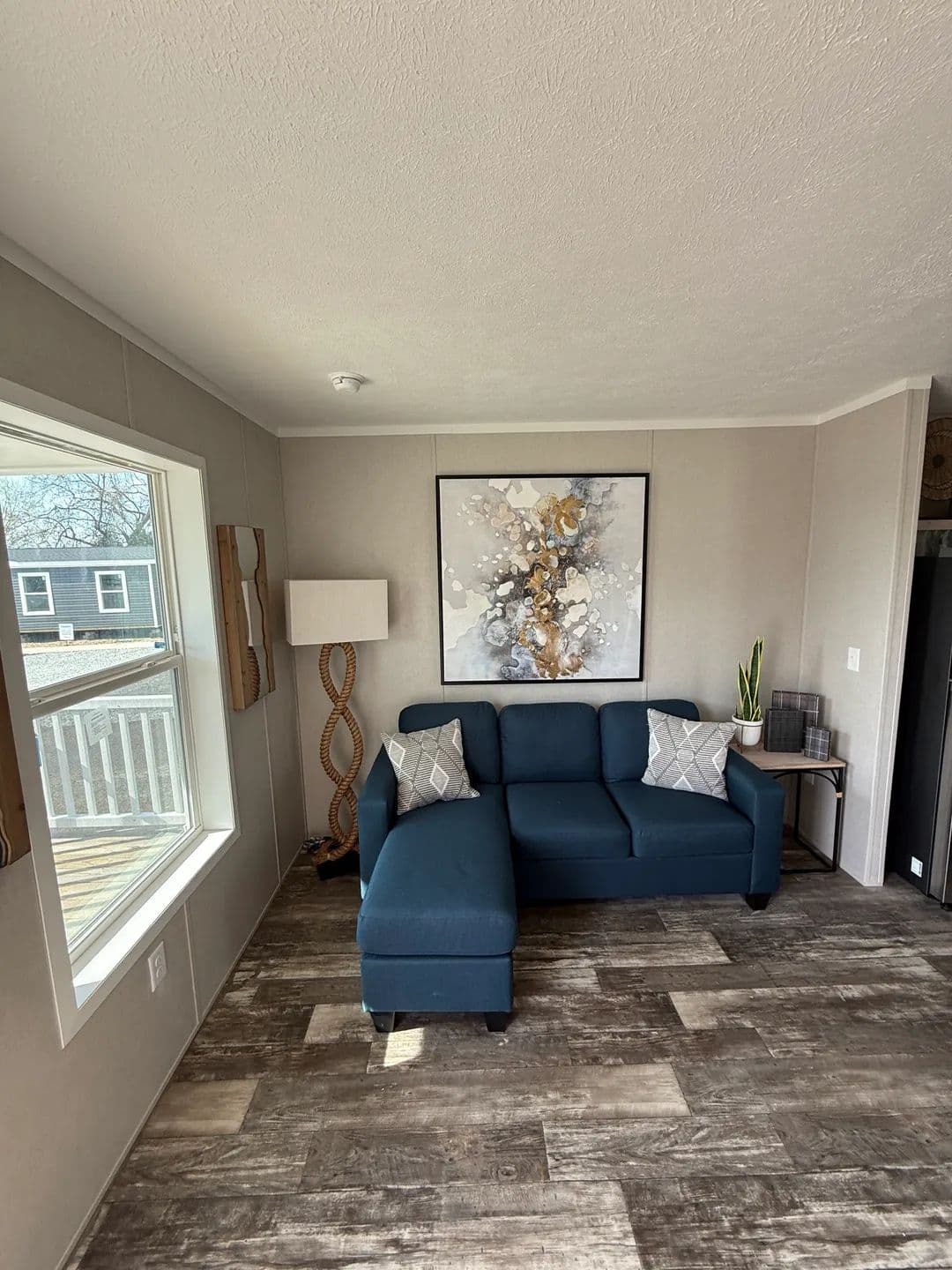 The ONYX Living Room. This Manufactured Mobile Home features 1 bedroom and 1 bath.