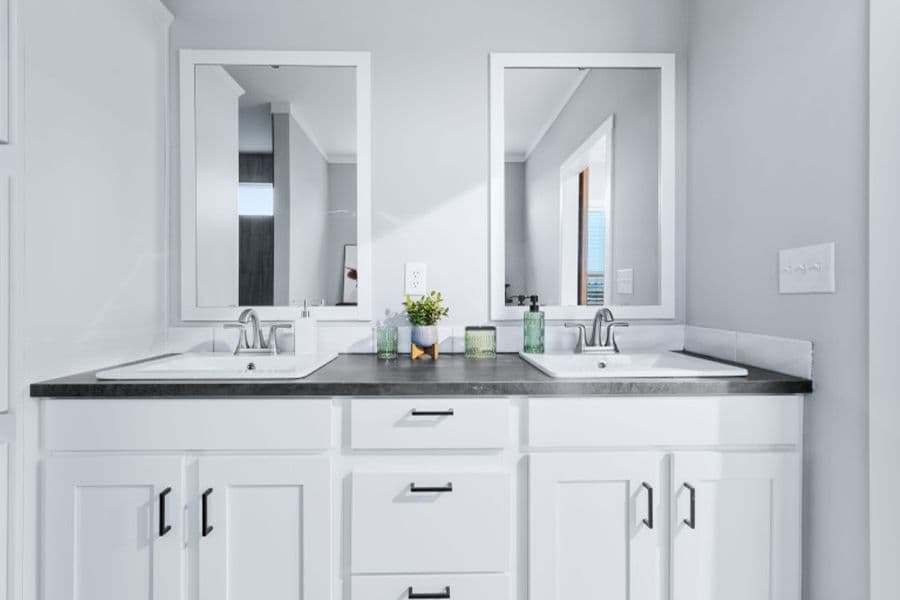The THE OLYMPUS Primary Bathroom. This Manufactured Mobile Home features 4 bedrooms and 3 baths.