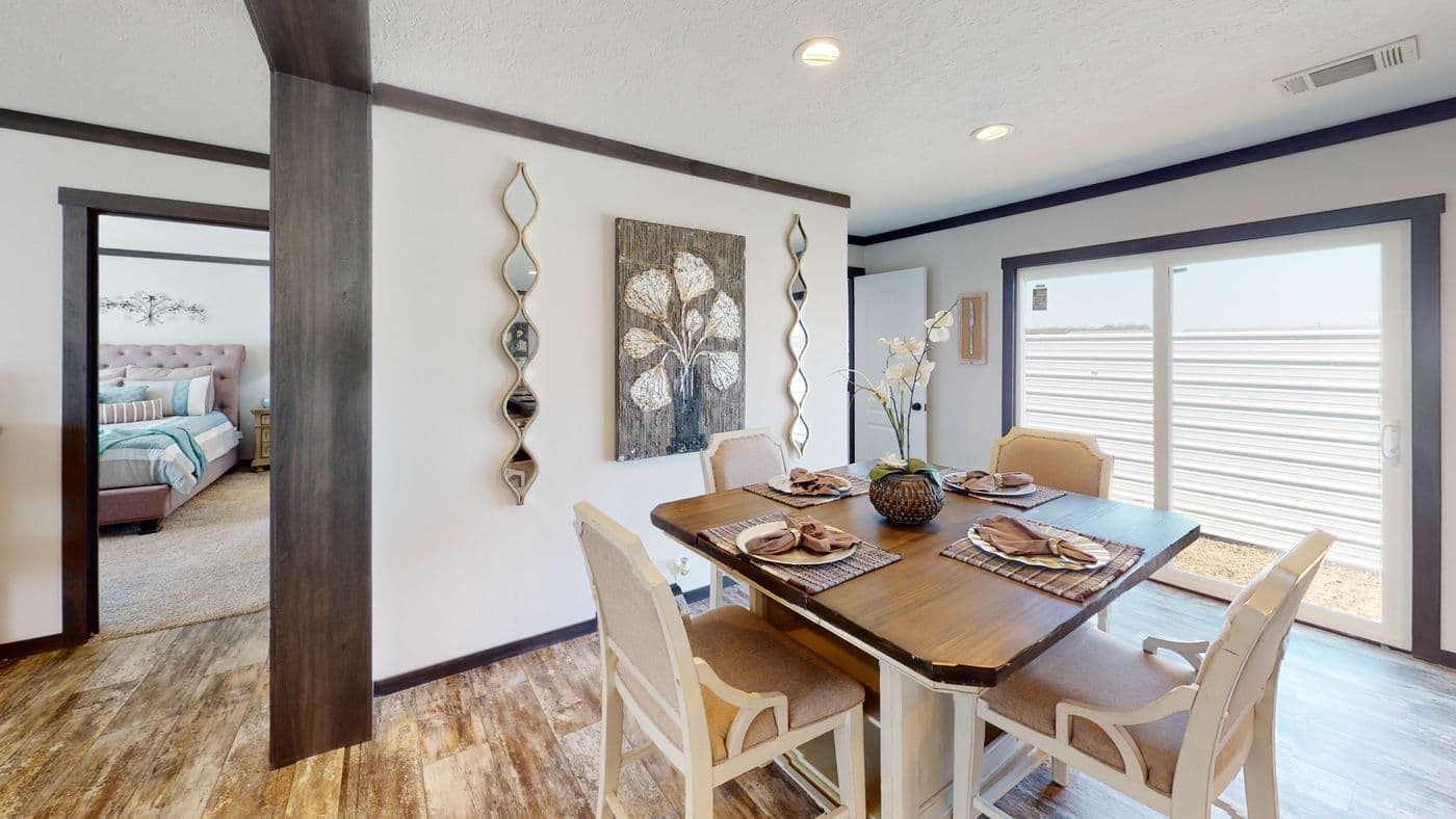 The BOUJEE XL 2 Dining Room. This Manufactured Mobile Home features 4 bedrooms and 3 baths.
