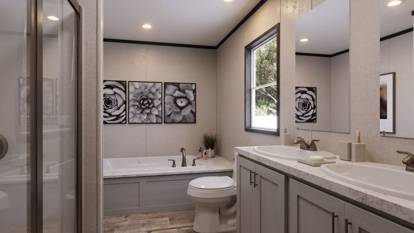 The THE MOUNTAINEER 52 Primary Bathroom. This Manufactured Mobile Home features 3 bedrooms and 2 baths.