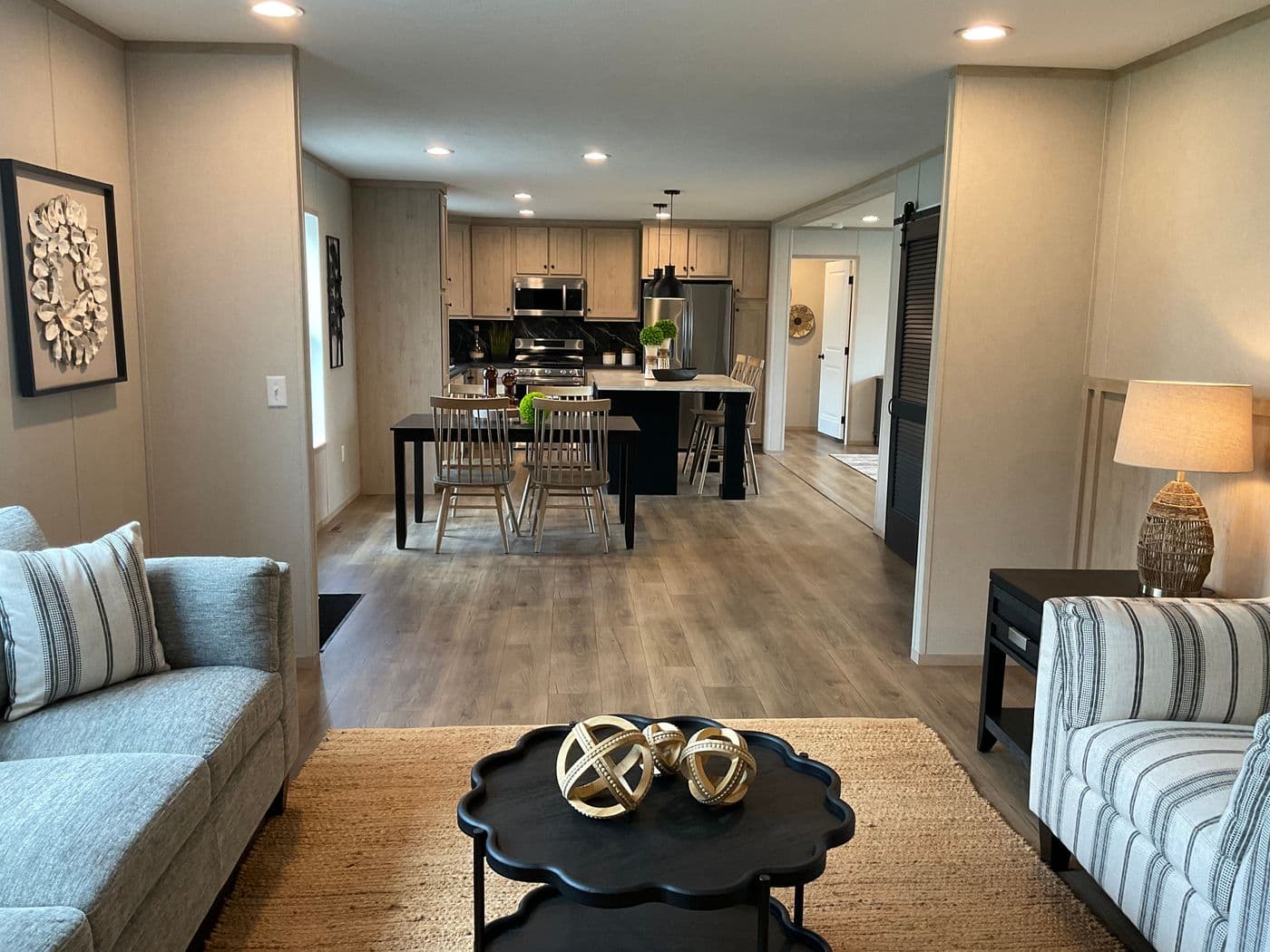 The EMERALD 7228-643 Living Room. This Manufactured Mobile Home features 4 bedrooms and 2 baths.