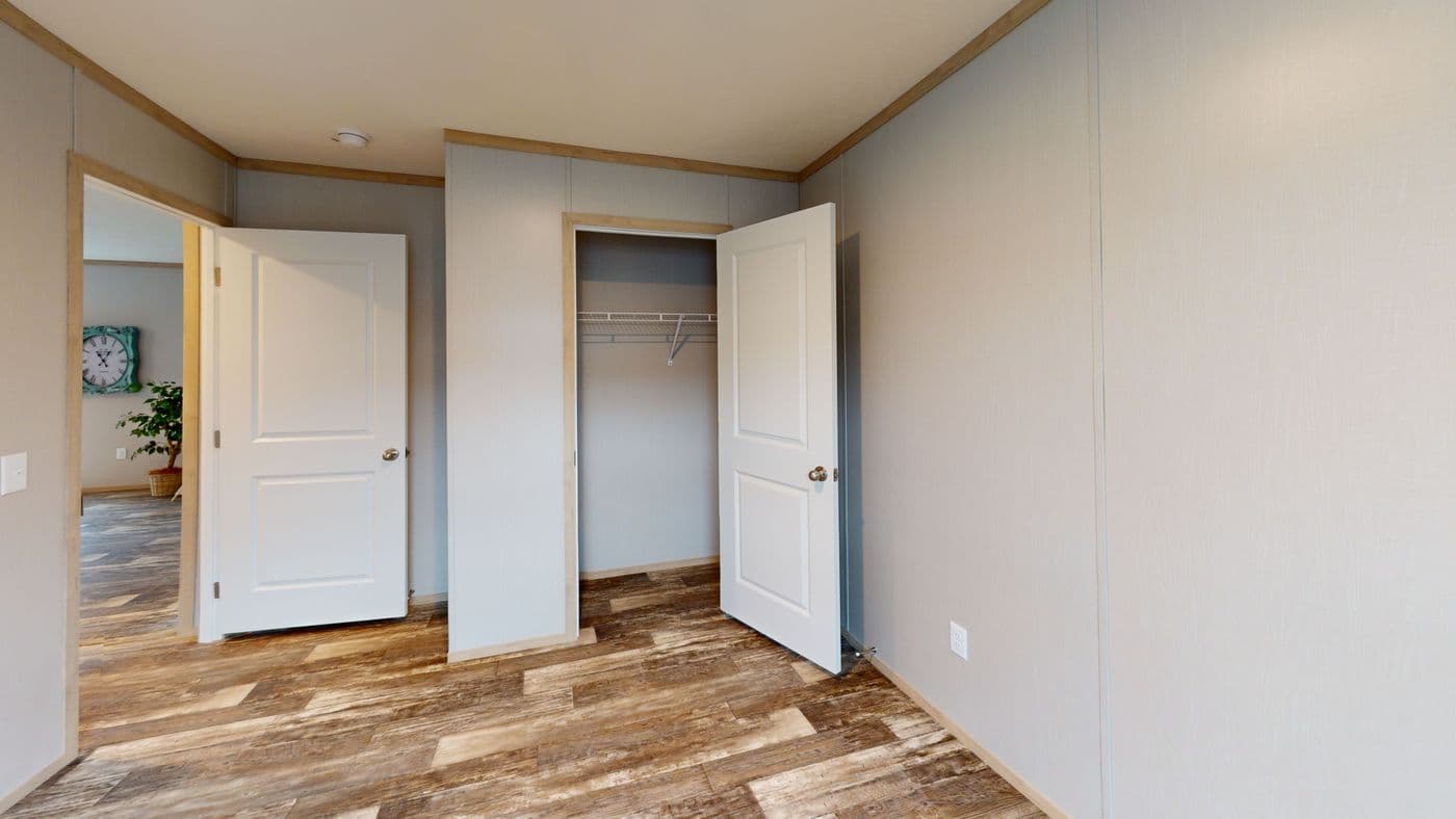 The HANCOCK Guest Bedroom. This Manufactured Mobile Home features 4 bedrooms and 2 baths.