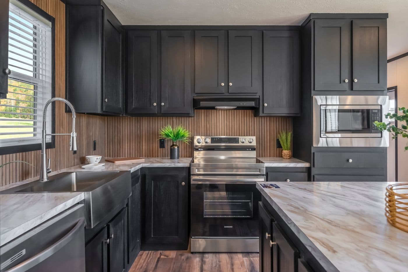 The RAVENWOOD Kitchen. This Manufactured Mobile Home features 3 bedrooms and 2 baths.