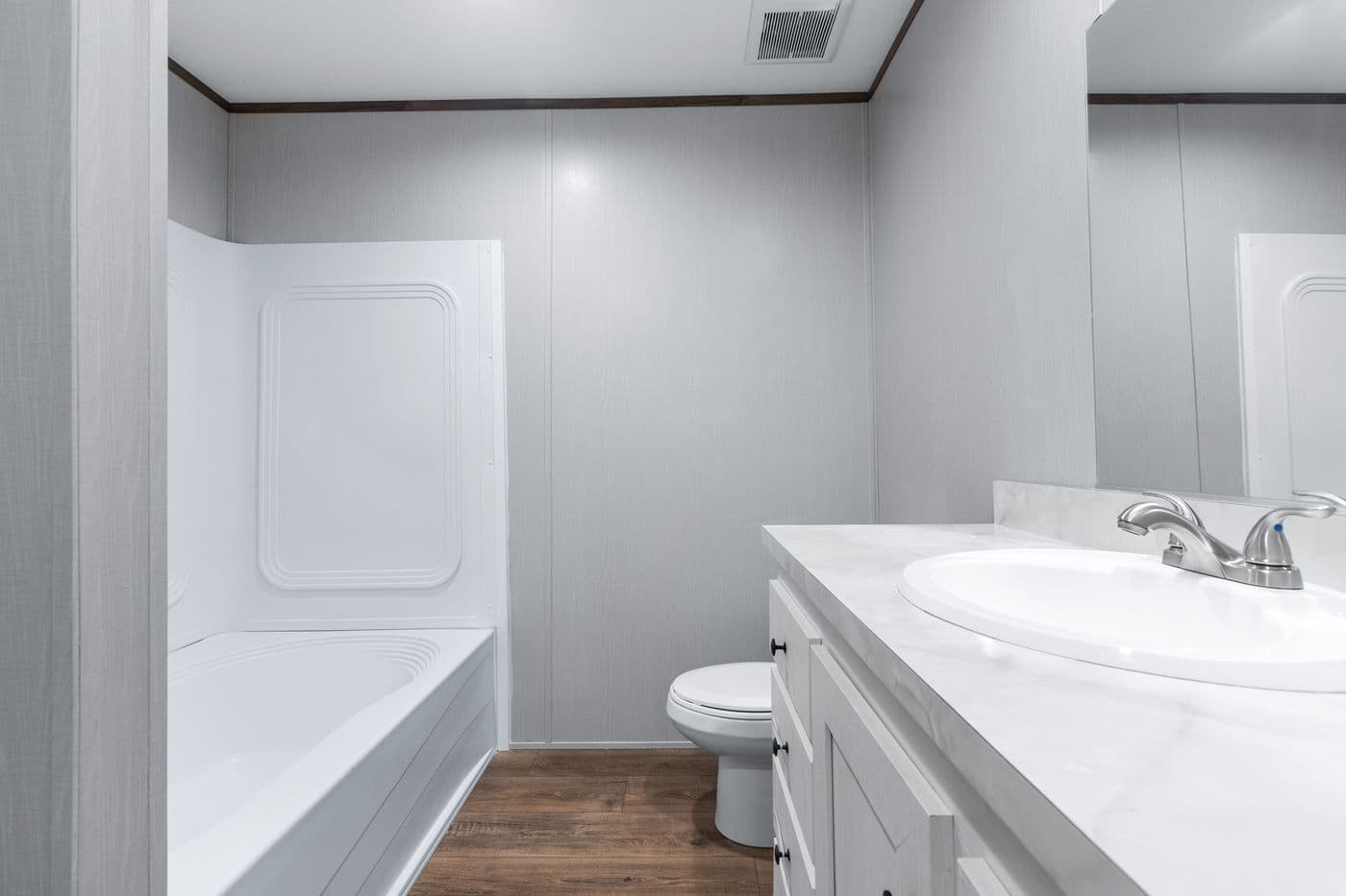 The HOMESTEAD 16602A Primary Bathroom. This Manufactured Mobile Home features 2 bedrooms and 2 baths.