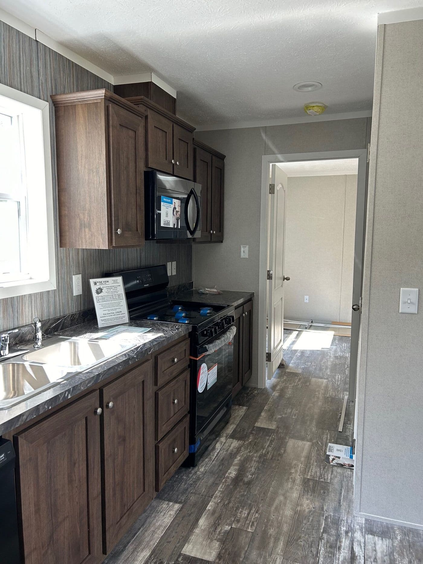 The SAPPHIRE XL 8016-644 Kitchen. This Manufactured Mobile Home features 3 bedrooms and 2 baths.
