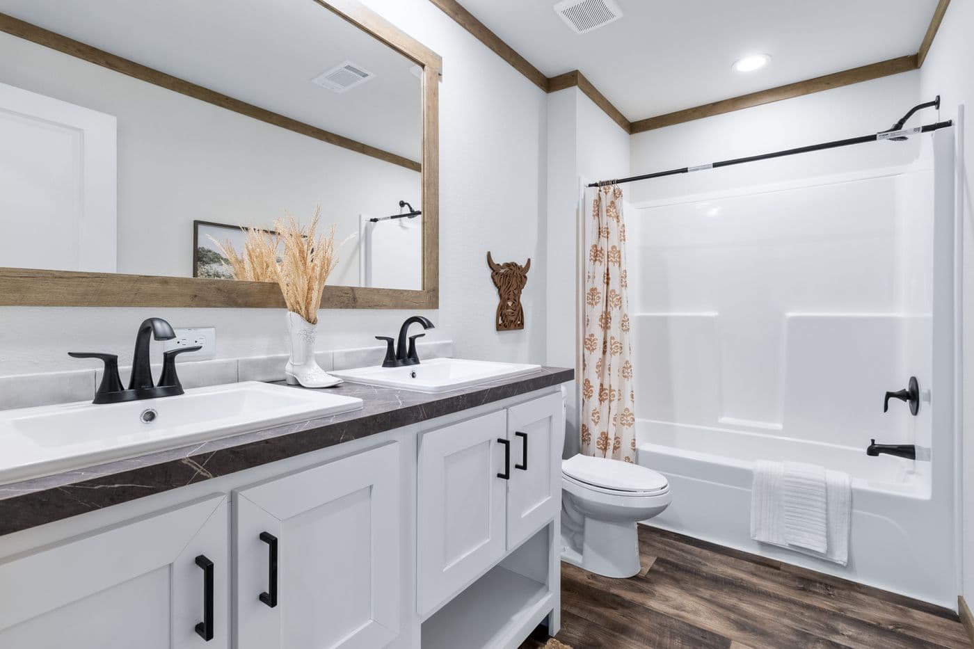 The SAWYER ELITE Guest Bathroom. This Manufactured Mobile Home features 3 bedrooms and 2 baths.