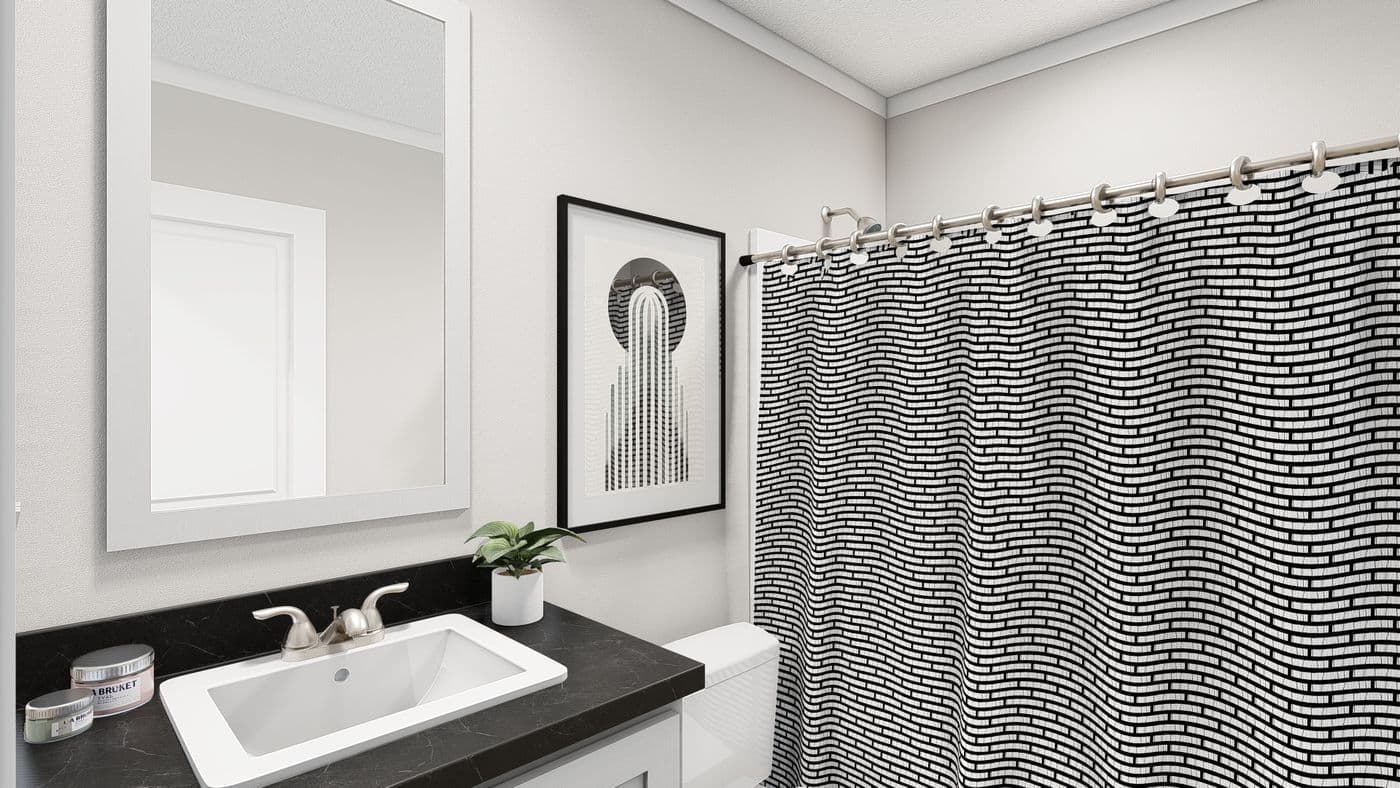 The HERE COMES THE SUN Guest Bathroom. This Manufactured Mobile Home features 3 bedrooms and 2 baths.