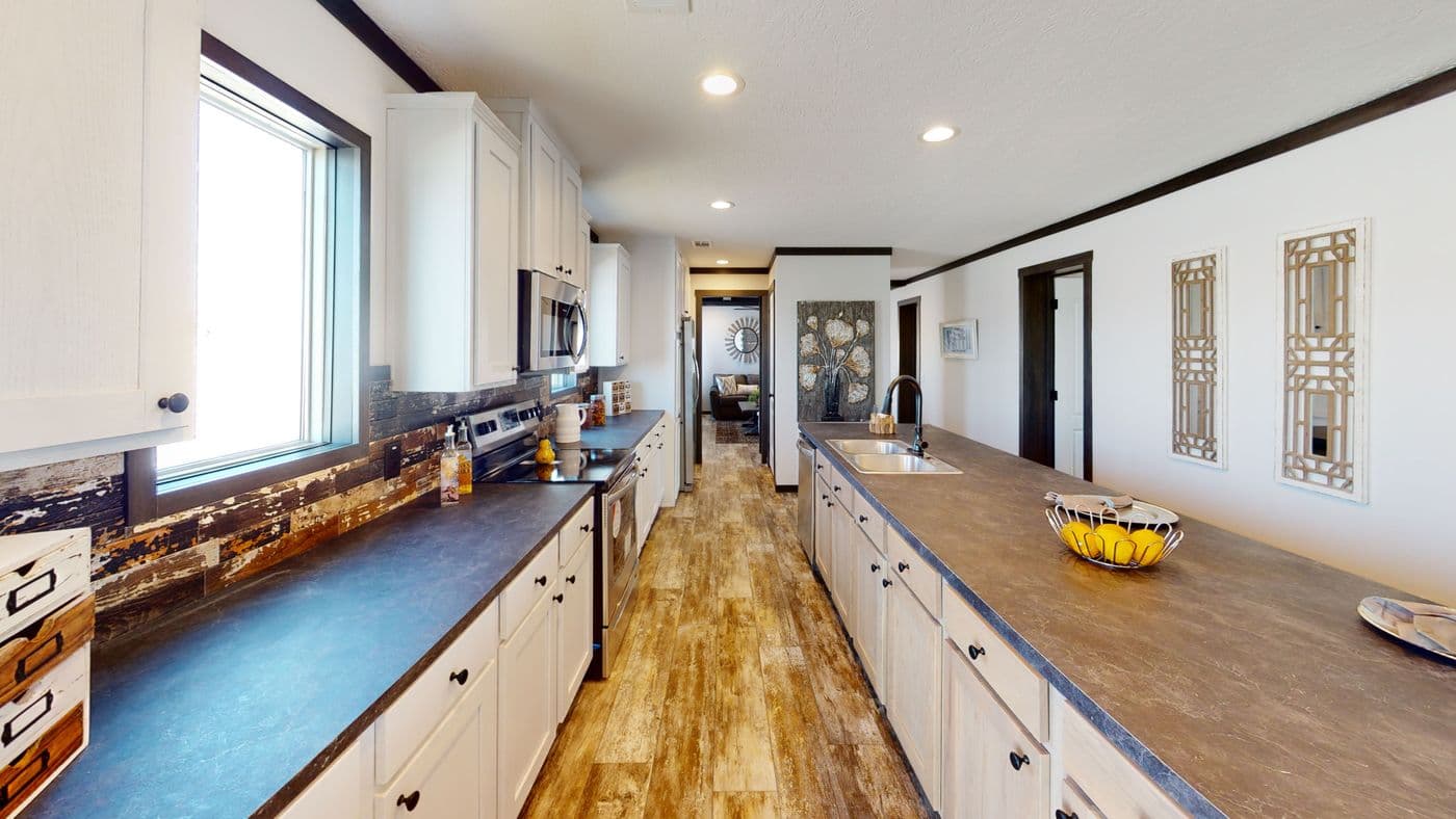 The BOUJEE XL 2 Kitchen. This Manufactured Mobile Home features 4 bedrooms and 3 baths.