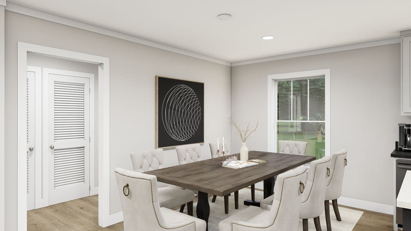 The LEAN ON ME Dining Area. This Manufactured Mobile Home features 3 bedrooms and 2 baths.