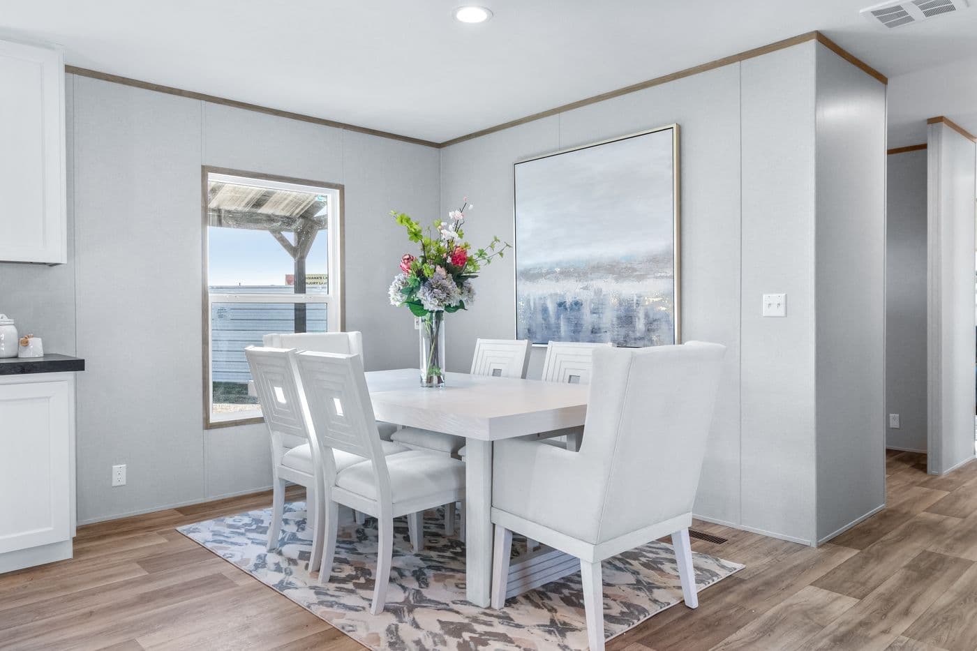 The ASPIRE Dining Area. This Manufactured Mobile Home features 3 bedrooms and 2 baths.
