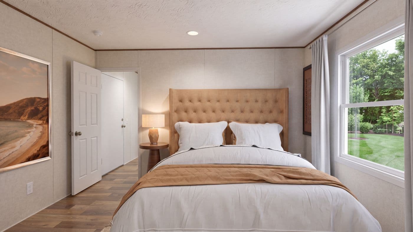 The HICKORY Primary Bedroom. This Manufactured Mobile Home features 3 bedrooms and 2 baths.