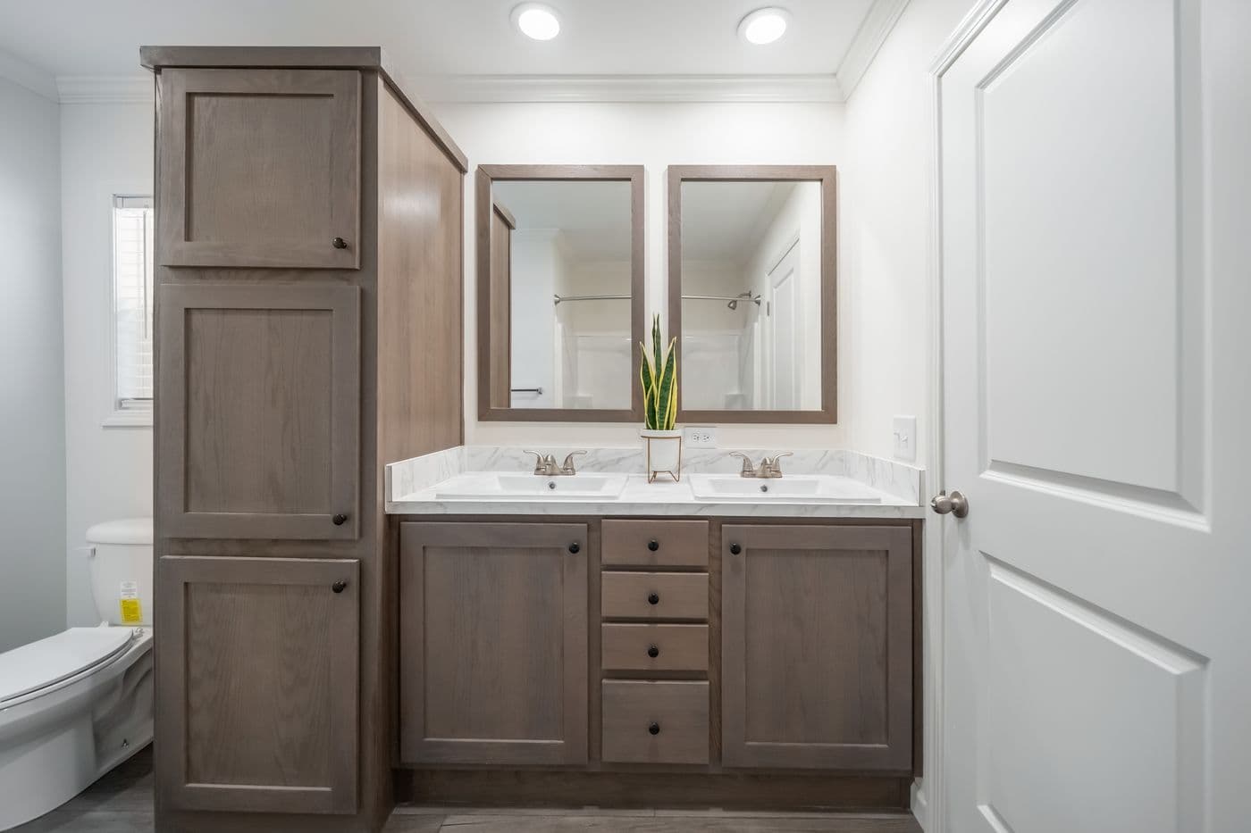 The 4200 "SOUTHPORT" 58'4X16 Primary Bathroom. This Manufactured Mobile Home features 2 bedrooms and 2 baths.