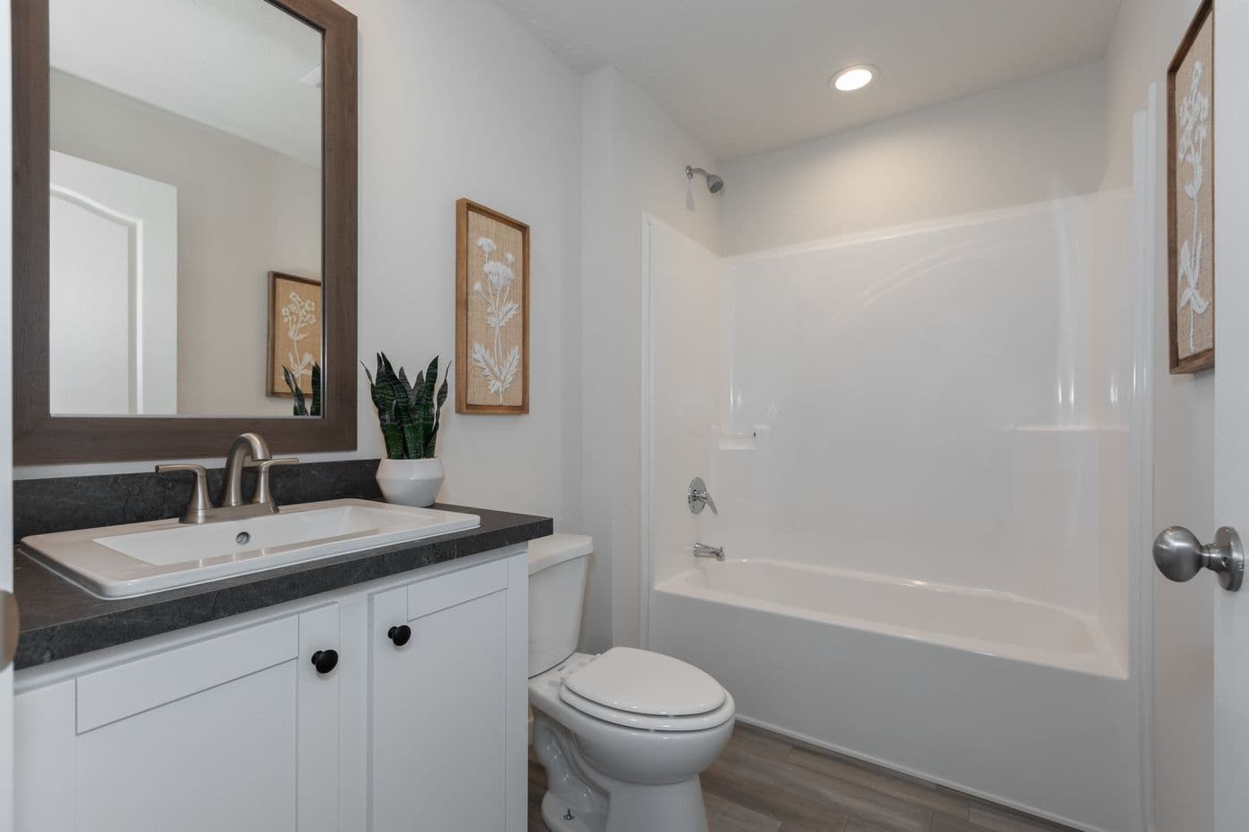 The CENTER ST/5228-MS014-1 SECT Guest Bathroom. This Manufactured Mobile Home features 3 bedrooms and 2 baths.