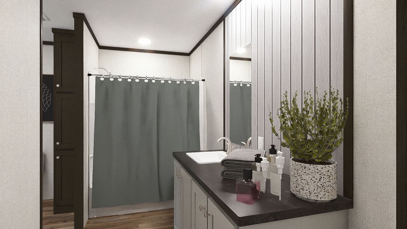 The AMBITION Primary Bathroom. This Manufactured Mobile Home features 4 bedrooms and 2 baths.
