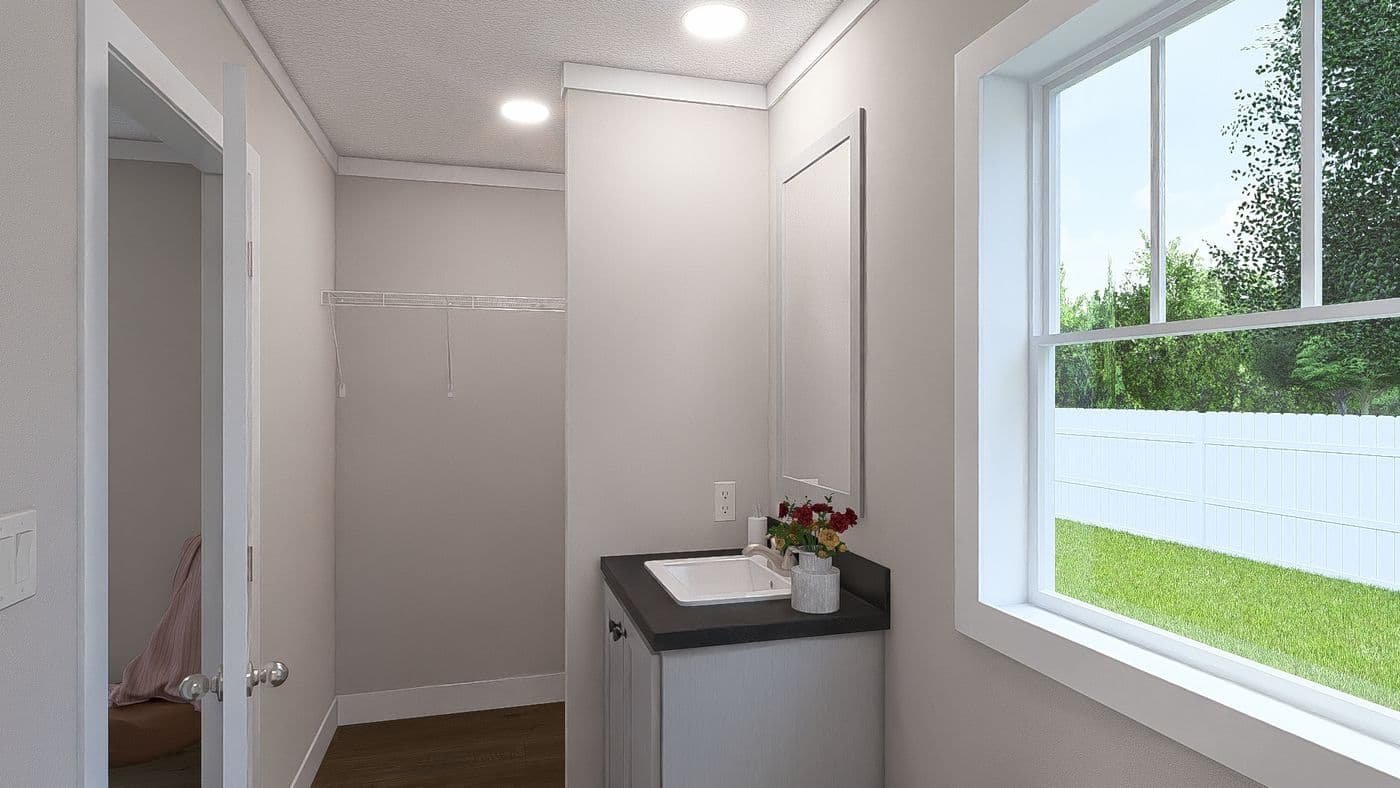 The MOVE ON UP Guest Bathroom. This Manufactured Mobile Home features 3 bedrooms and 2 baths.