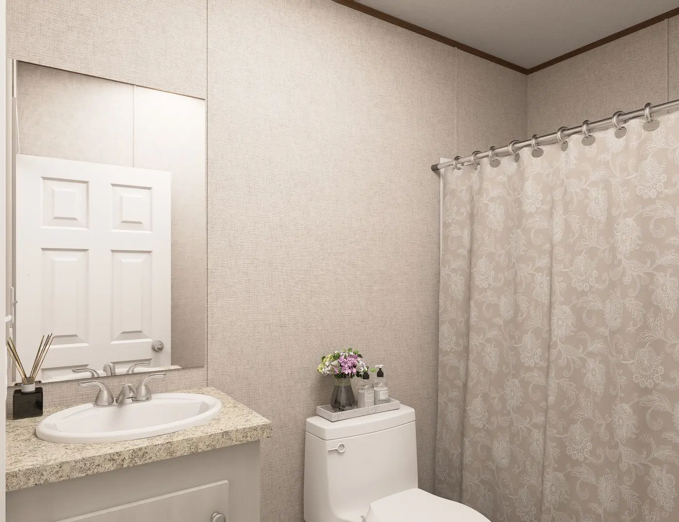 The SPRUCE Guest Bathroom. This Manufactured Mobile Home features 3 bedrooms and 2 baths.