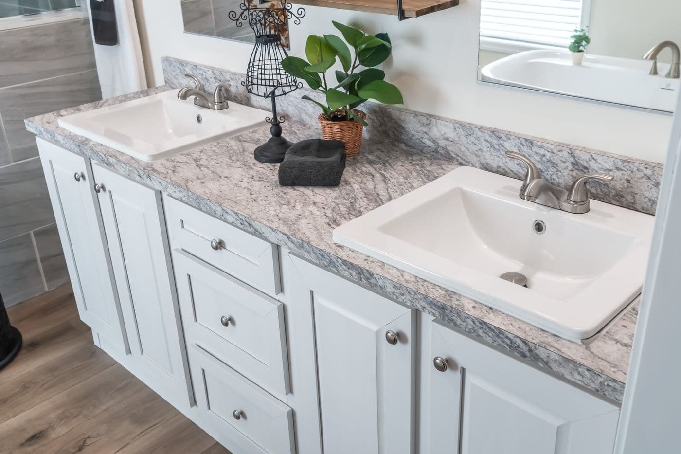 The 4210 "CAROLINA" 5628 Primary Bathroom. This Manufactured Mobile Home features 3 bedrooms and 2 baths.