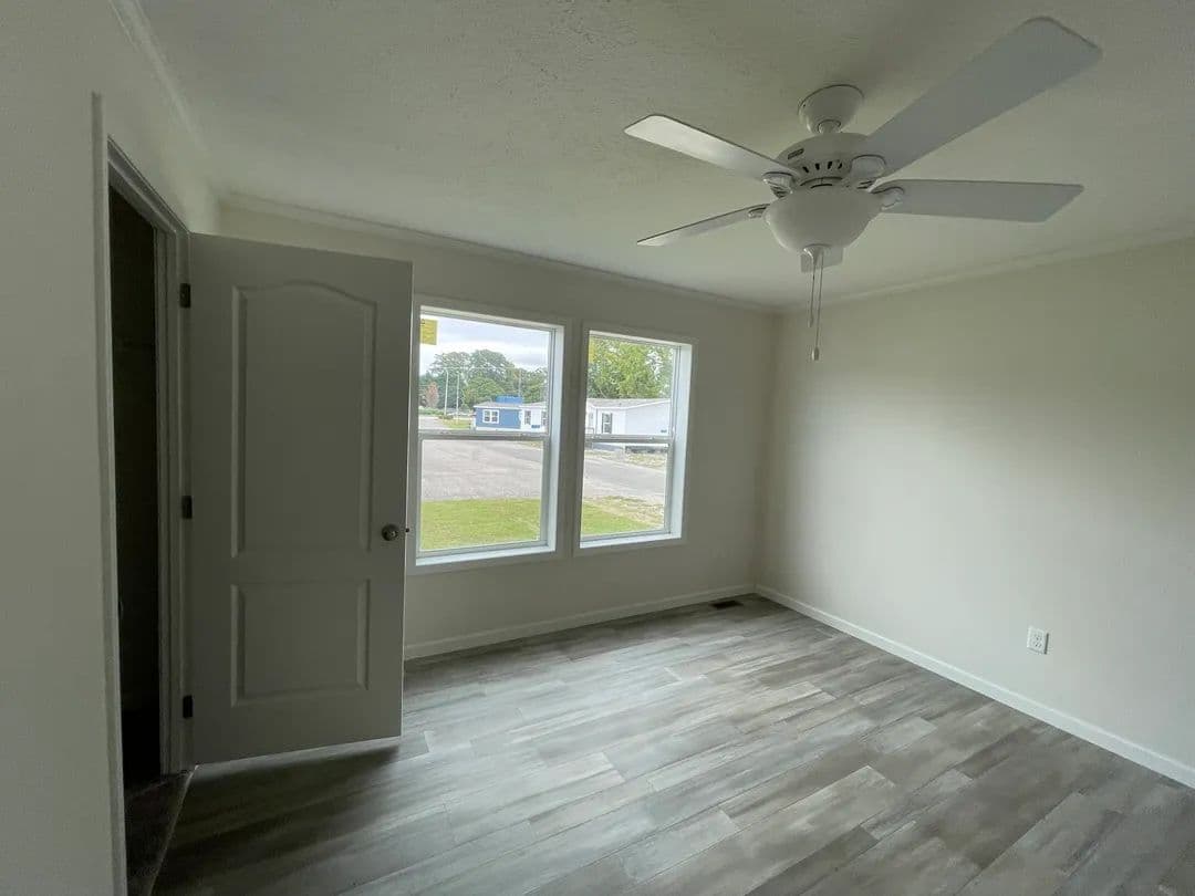 The MOONSTONE Primary Bedroom. This Manufactured Mobile Home features 3 bedrooms and 2 baths.