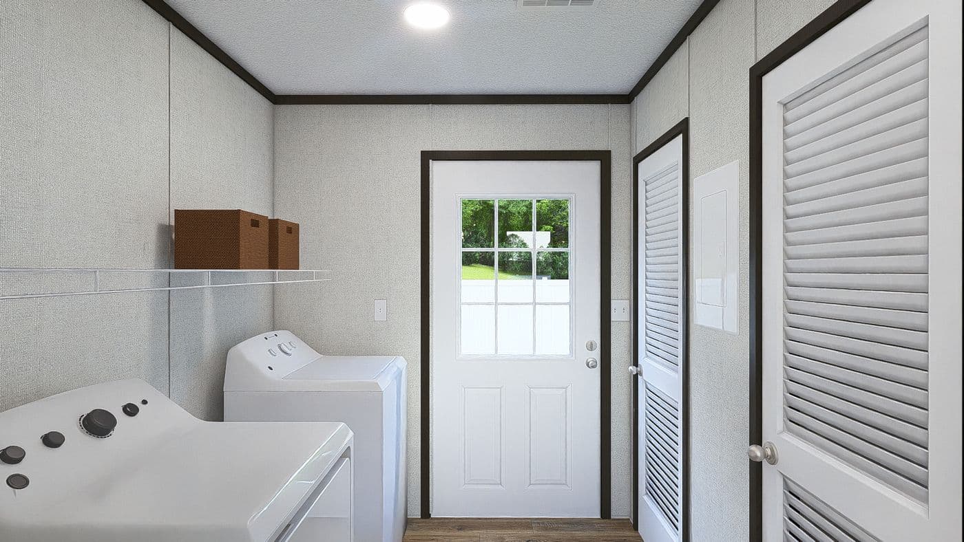 The GRAND Utility Room. This Manufactured Mobile Home features 3 bedrooms and 2 baths.