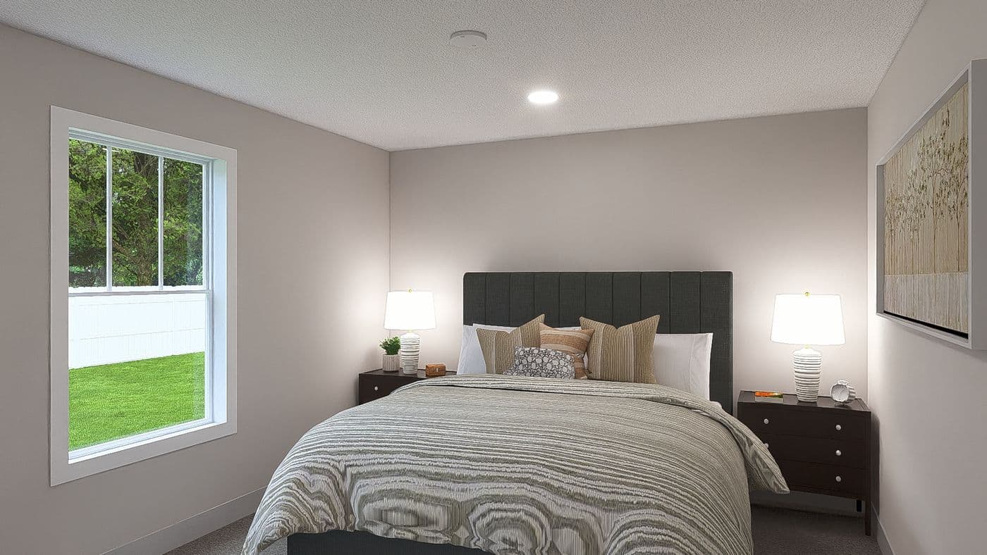 The HERE COMES THE SUN Primary Bedroom. This Manufactured Mobile Home features 3 bedrooms and 2 baths.
