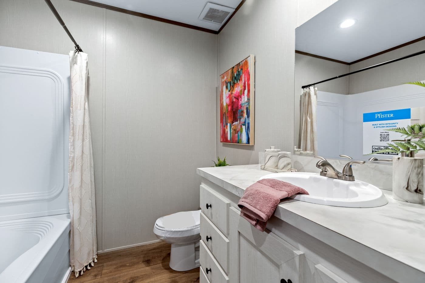 The HOMESTEAD 16763A Primary Bathroom. This Manufactured Mobile Home features 3 bedrooms and 2 baths.