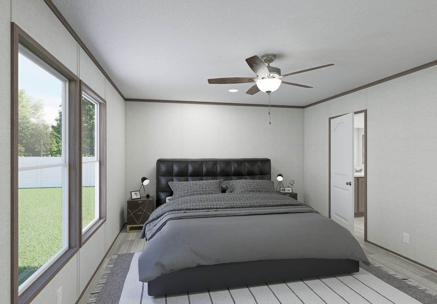 The THE MOUNTAINEER 64 Primary Bedroom. This Manufactured Mobile Home features 3 bedrooms and 2 baths.